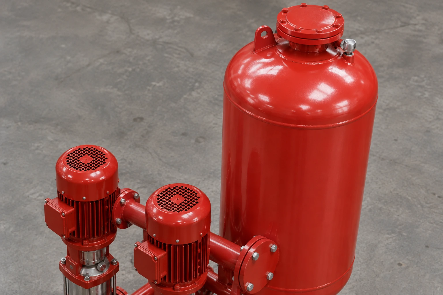 Close upper exterior of reference red pressure vessel and twin pump motors